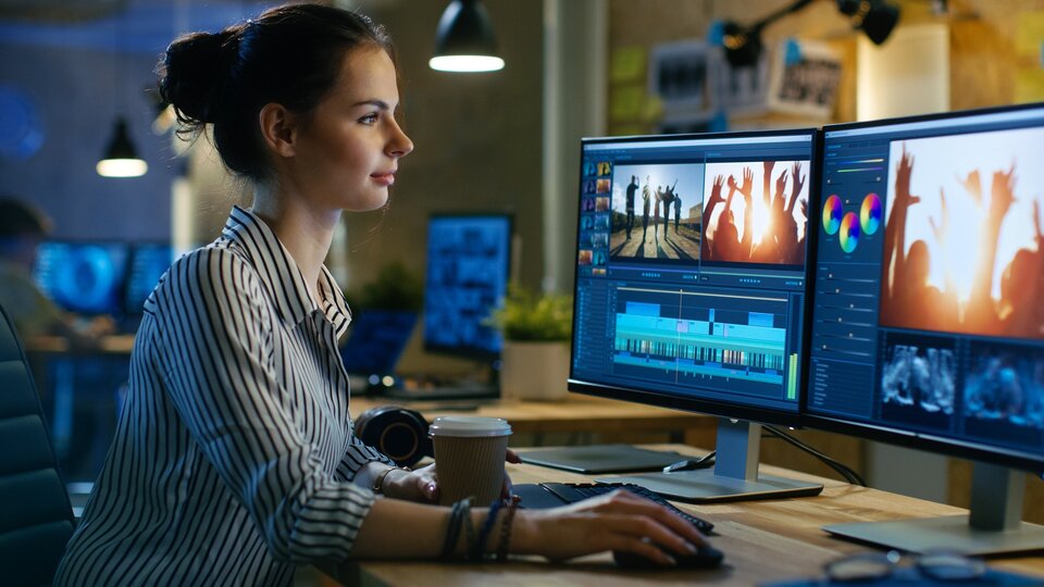 young women at cybertools reviewing a client's cybersecurity